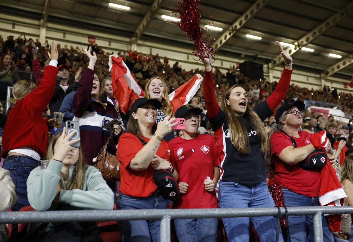 Rugby - Women's World Cup 2025 - Semi Finals - New Zealand v Canada - Ashton Gate, Bristol, Britain - September 19, 2025 Canada fans celebrate after the match Action Images via Reuters/Peter Cziborra