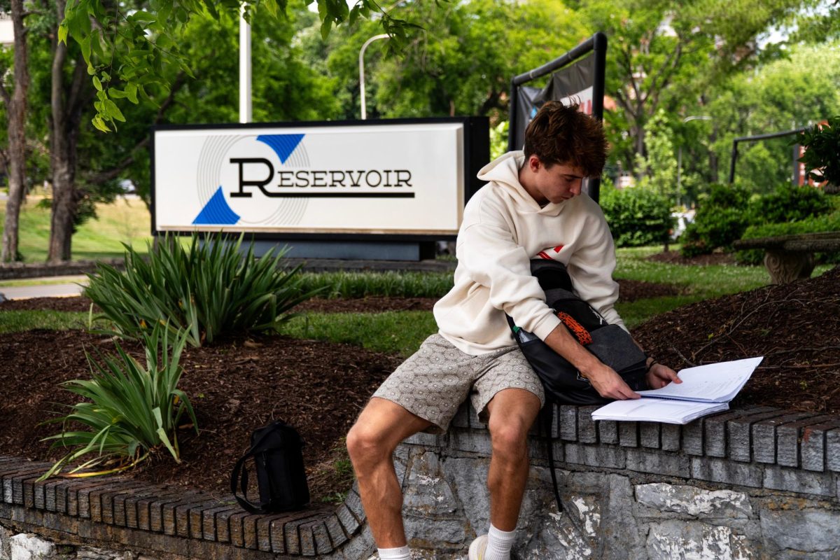 A student sits outside the Nashville offices of Reservoir Media, an independent music publishing company. Photo by Charles Hall.