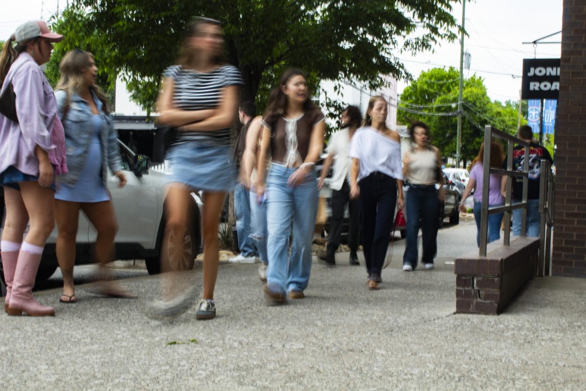 Pedestrians stroll 12th Avenue South in Nashville, TN on a Saturday. Photo by Theo Burgess.